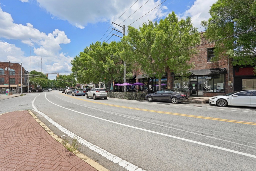 Kirkwood: A street view with cars parked on the side and a sidewalk.
